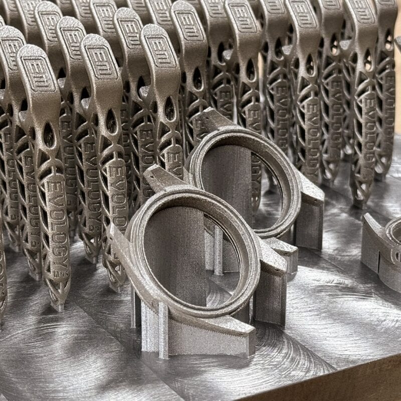 A build plate of identical metal parts printed in one DMLS run