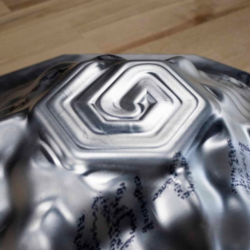 Digitally formed sheet metal prototype part on a workbench