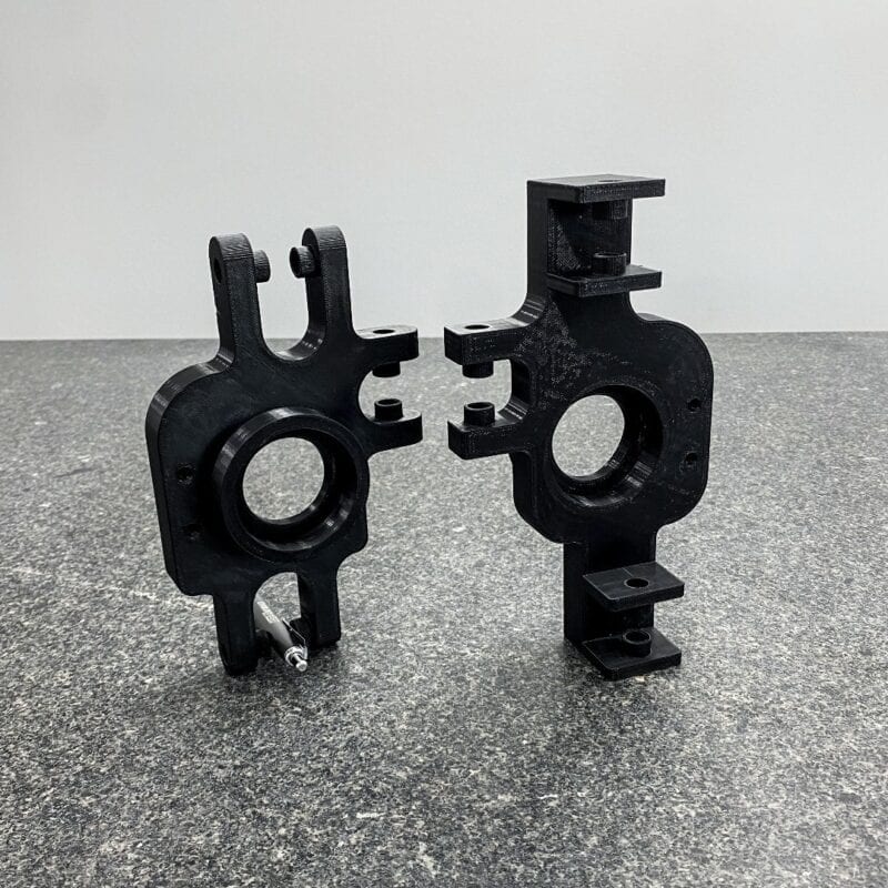 FDM-printed functional brackets in black thermoplastic
