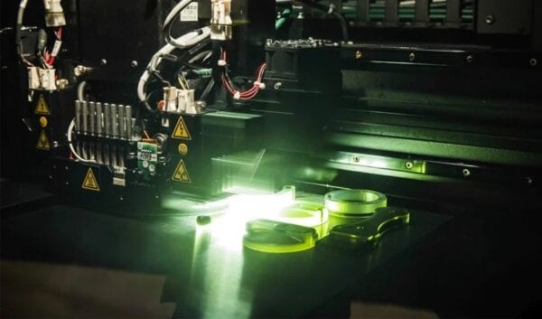 PolyJet print head curing photopolymer with UV light during a build
