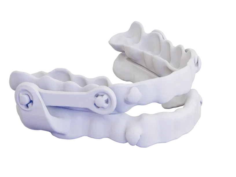 SLS-printed orthodontic device with hinged arms built as a single assembly
