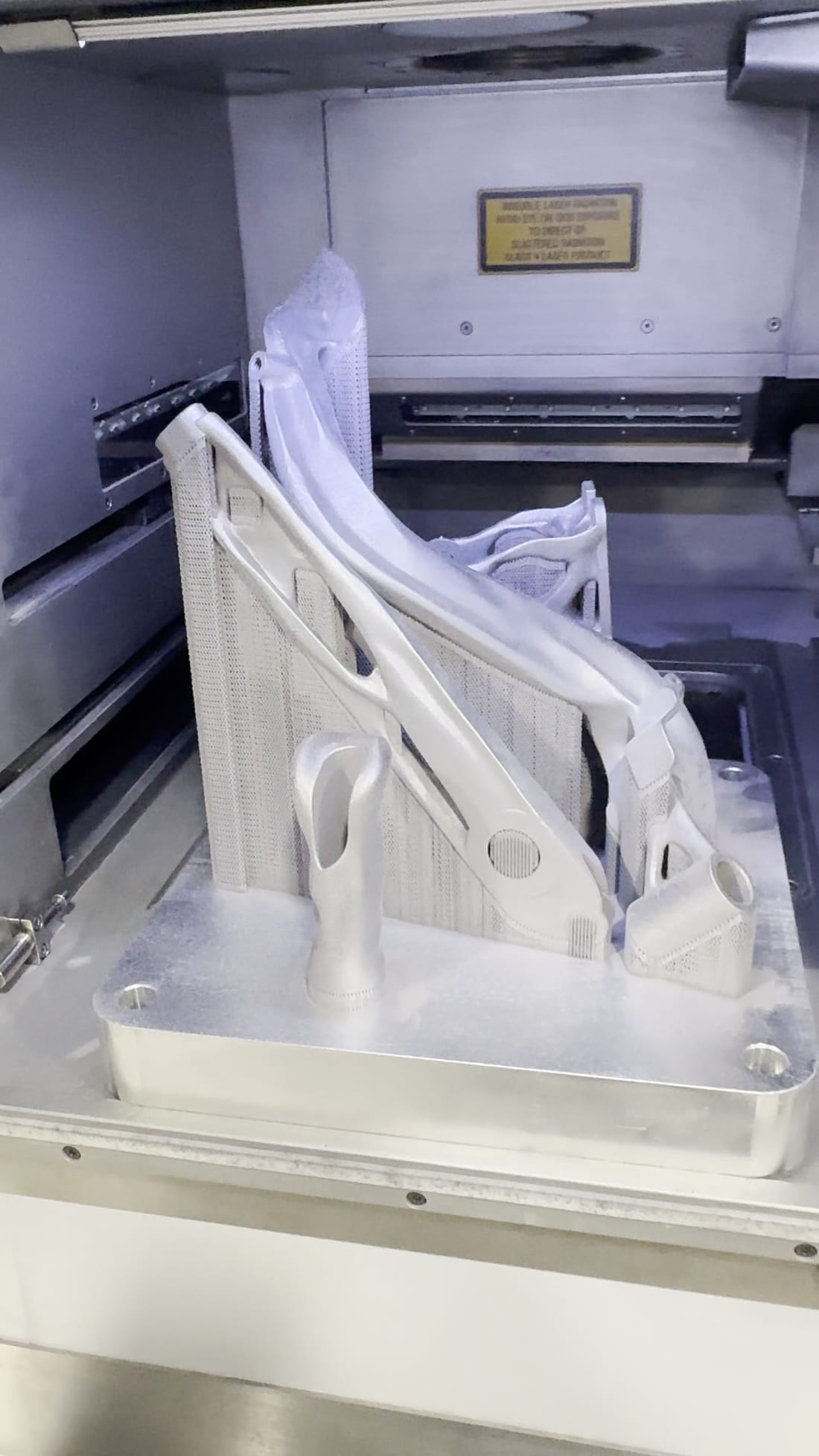 Front view of the FDF Raceshop parts printed together on the DMLS build plate