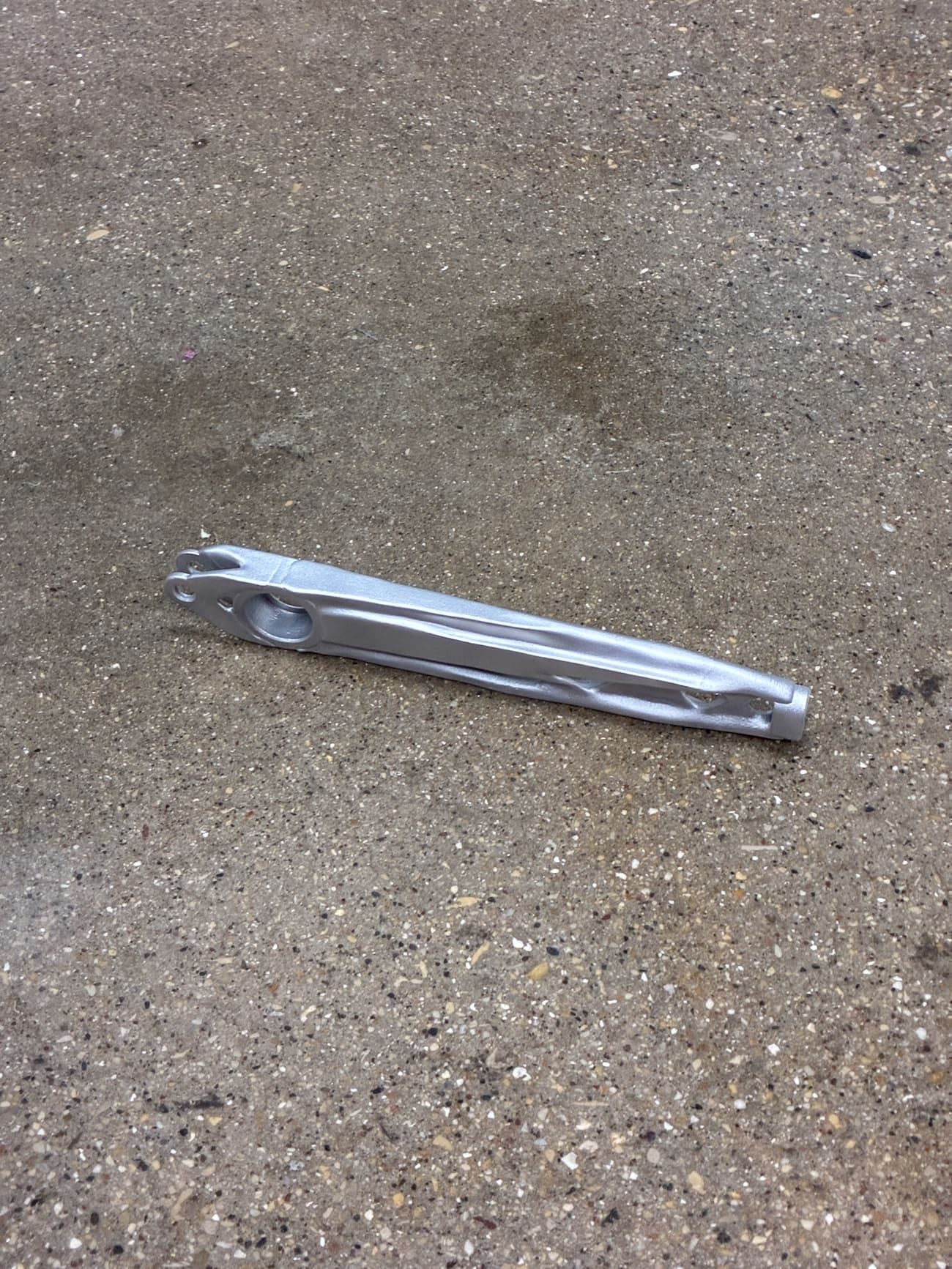 The printed handbrake lever body with lightening cutouts