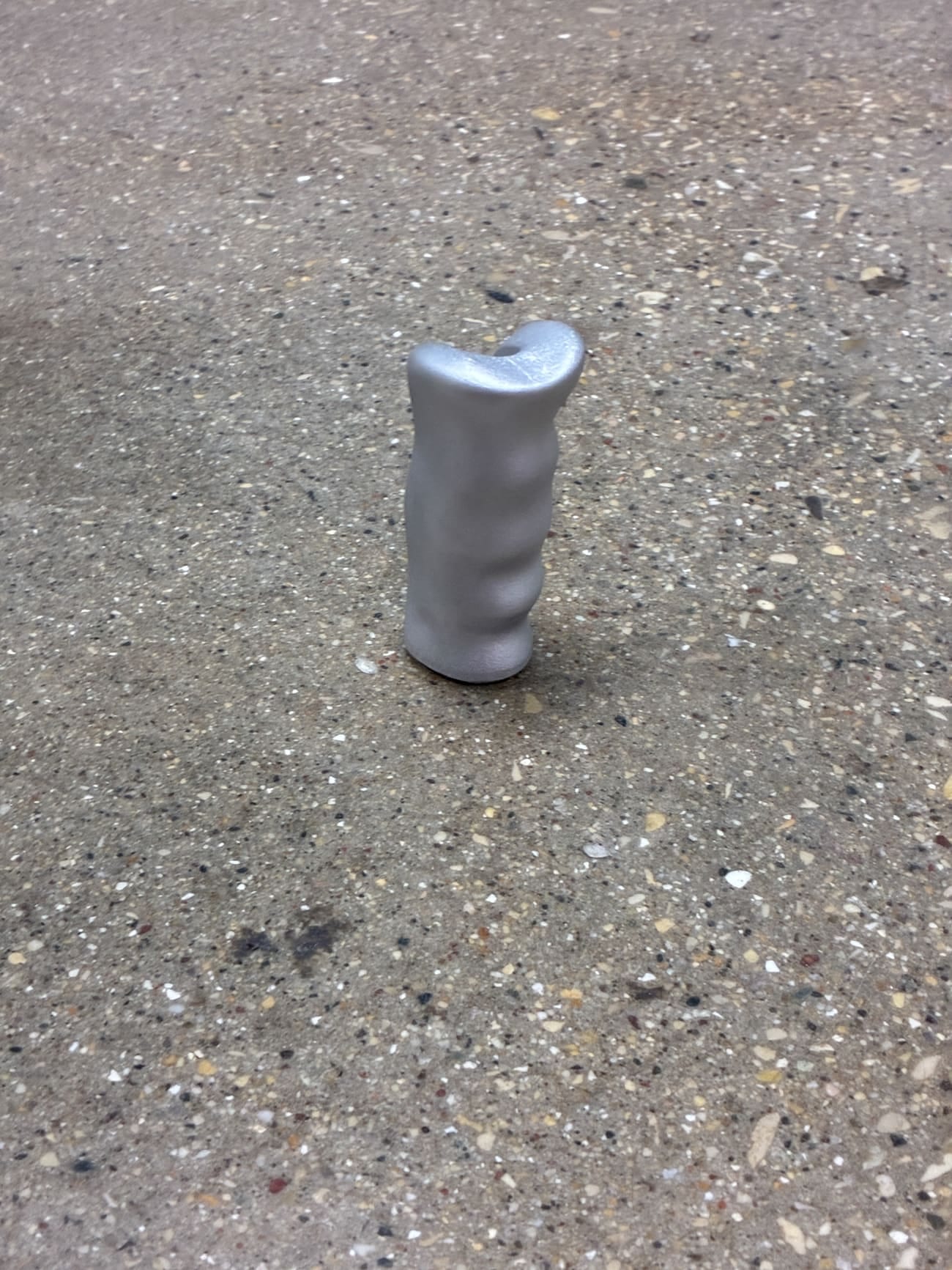 The sculpted handbrake grip standing on the shop floor