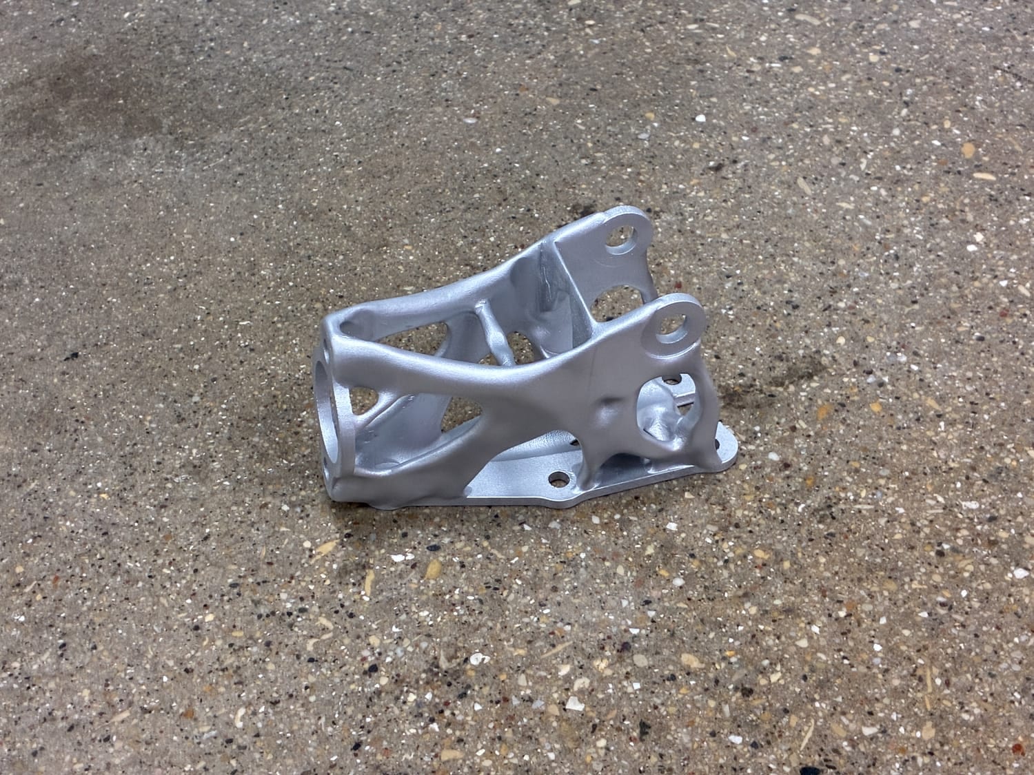 Close-up of the printed handbrake mount showing well-clearanced bolt access and avoidance regions