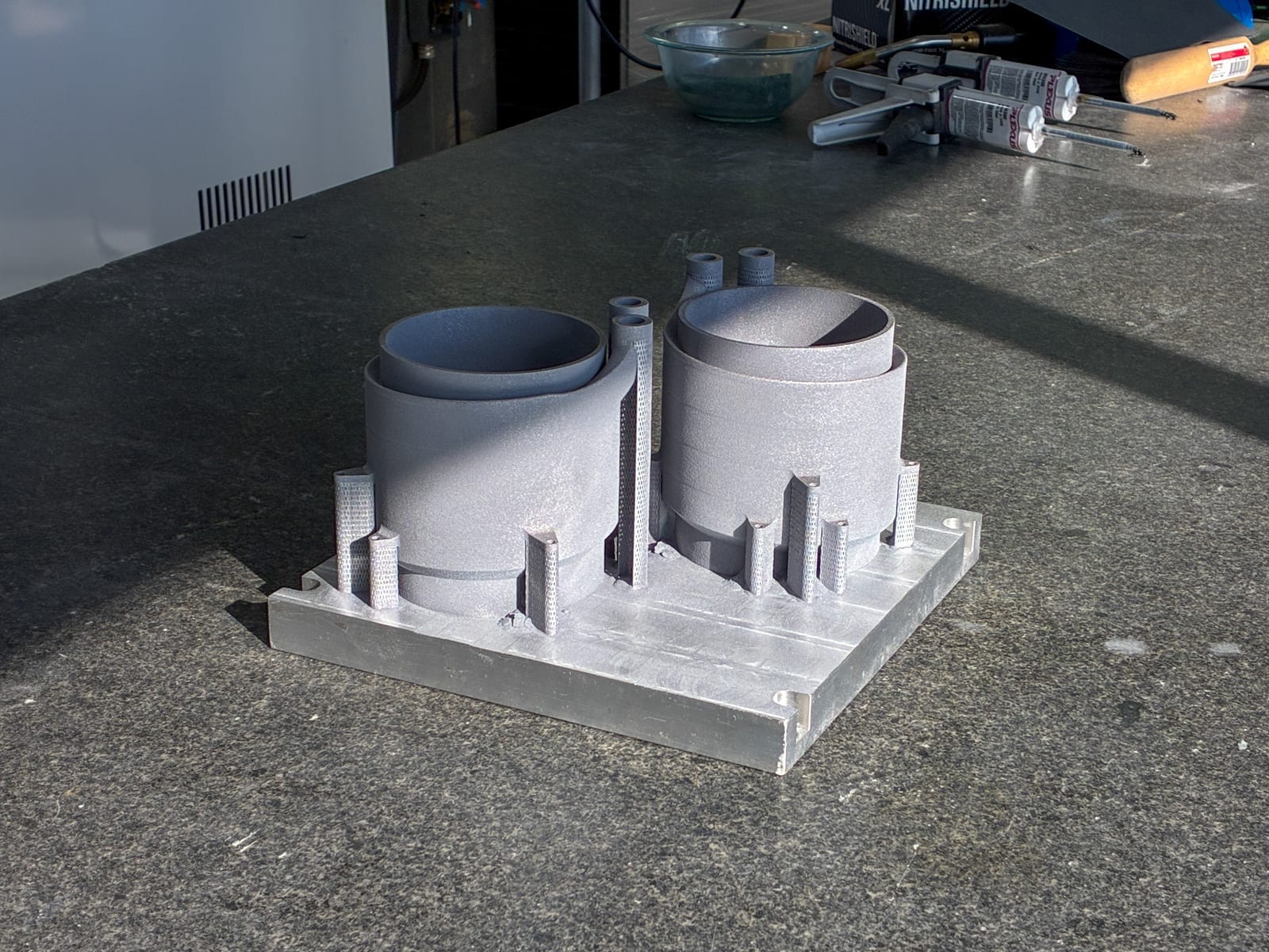 As-printed cooling sleeves on the bench after the build