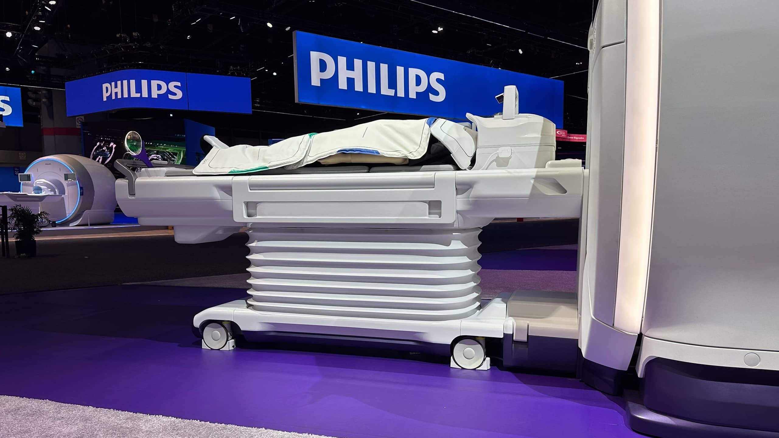 The finished FDM-printed MRI patient table on display at a trade show booth