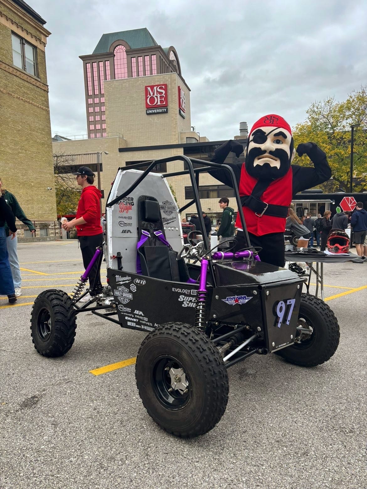 MSOE Raider Racing Baja car number 97 on campus with the school mascot