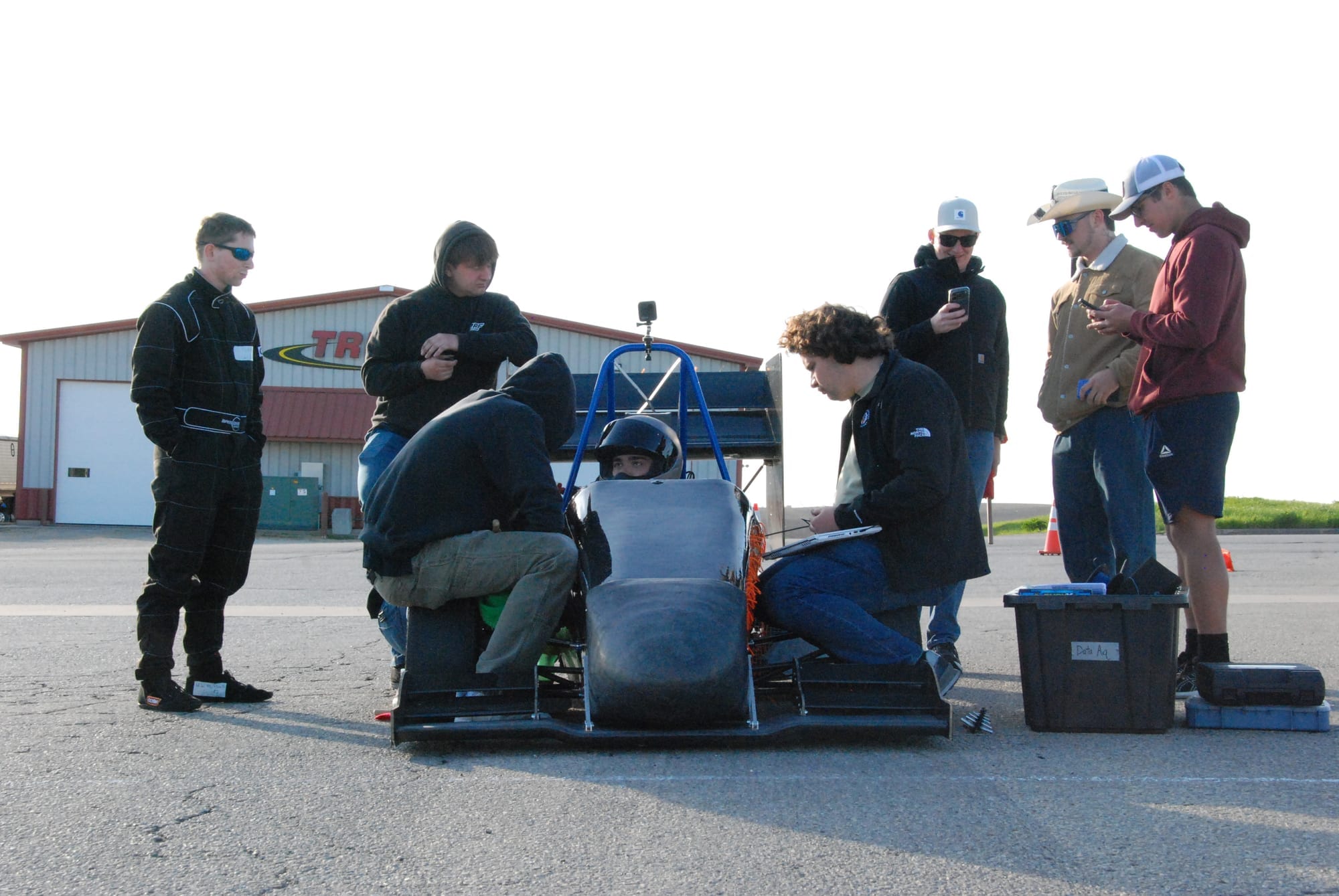 Pioneer Racing students gathered around PR26 during a test day