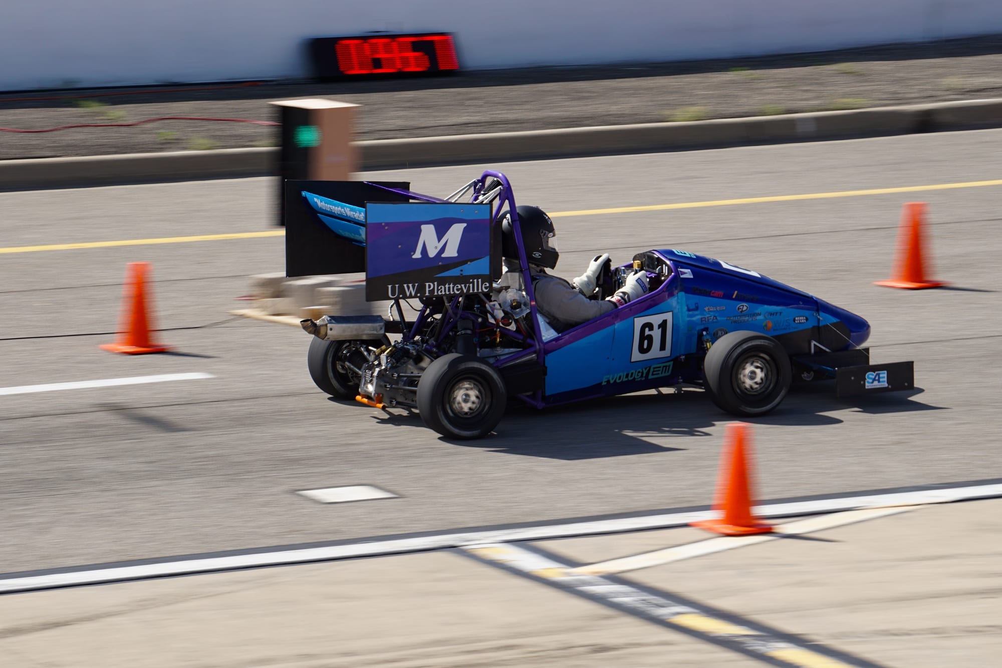 PR26 on a timed run, with U.W. Platteville branding on the rear wing