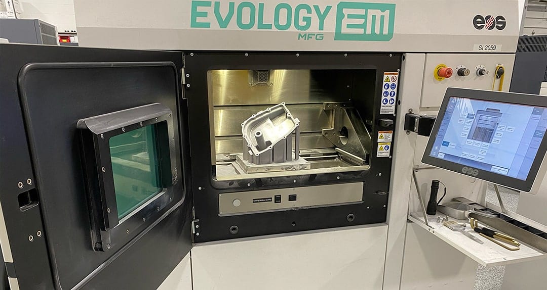 The PR25 oil pan on the build plate inside Evology's DMLS system
