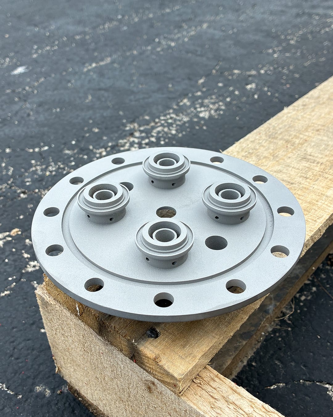3D printed metal defense component on a workbench